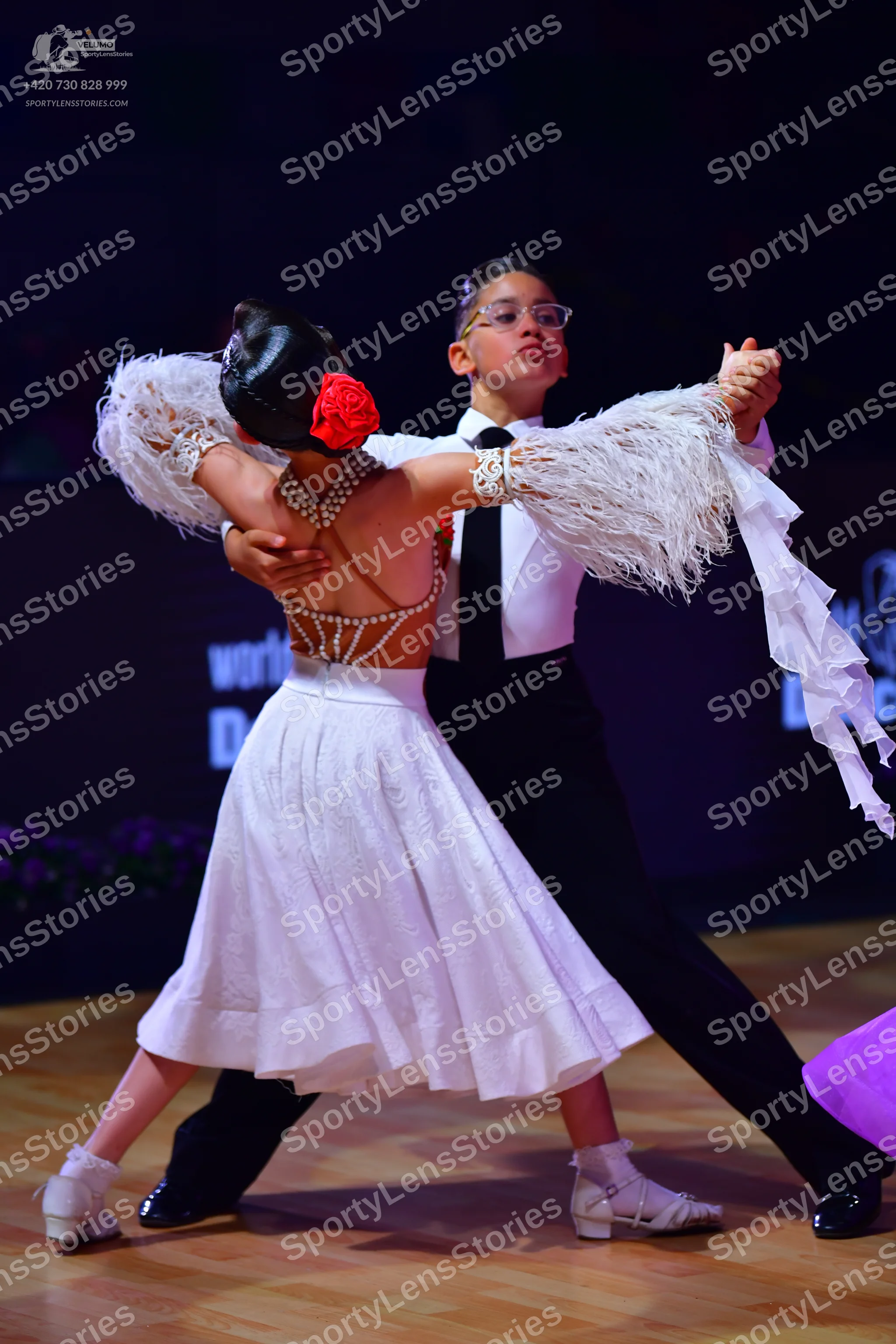 Dancesport competitor: Male dancer: white long-sleeved shirt, black tie, and black trousers