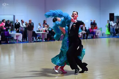 Dancesport competitor: Male dancer: black suit with a white shirt and black bow tie