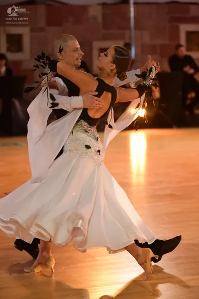 Dancesport competitor: Male dancer: black top