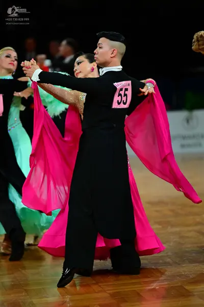 Dancesport competitor #55: Male dancer: black long-sleeved shirt and black trousers
