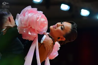 Dancesport competitor: Male dancer: dark-colored suit jacket