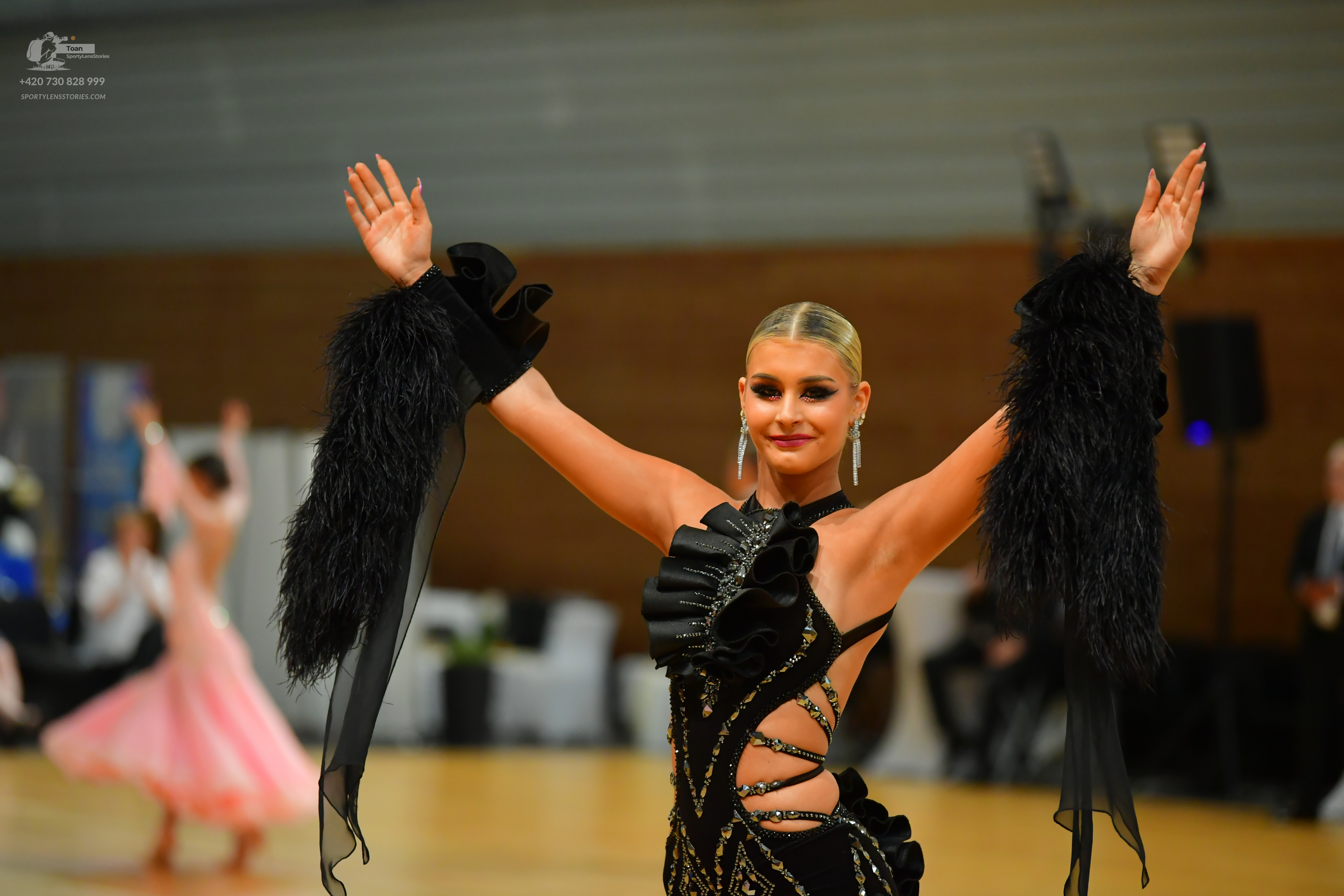 Dancesport competitor: Male** 720 999 - Black tail suit with black sequin lapels and a black feathered 