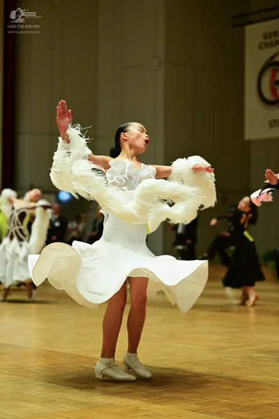 Dancesport competitor: ** White Latin dress