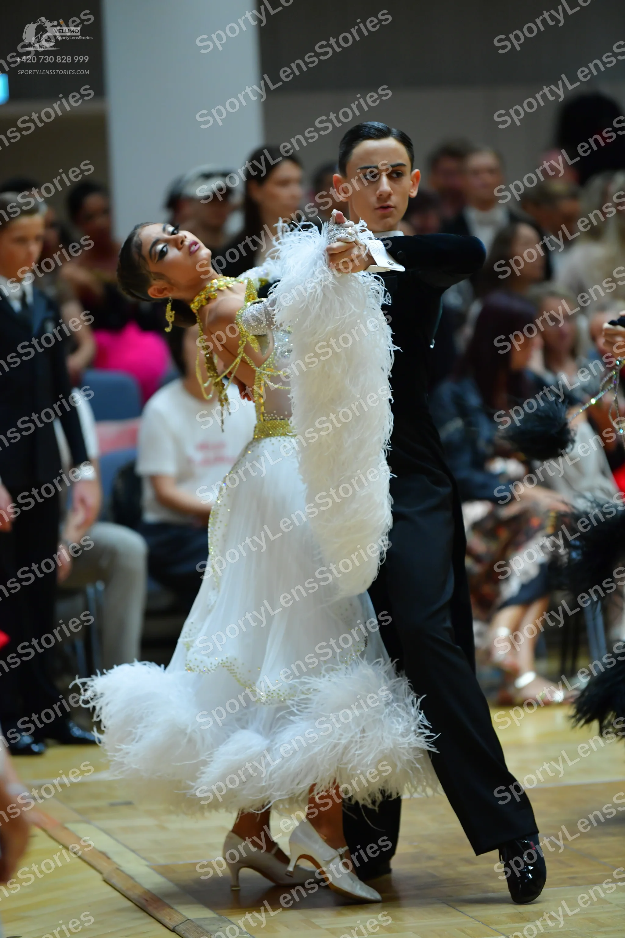 Dancesport competitor: Male dancer: black long-sleeved top and black trousers