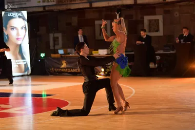 Dancesport competitor: Male dancer: black long-sleeved shirt and black trousers