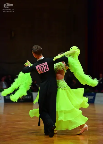 Dancesport competitor: Male dancer: black suit