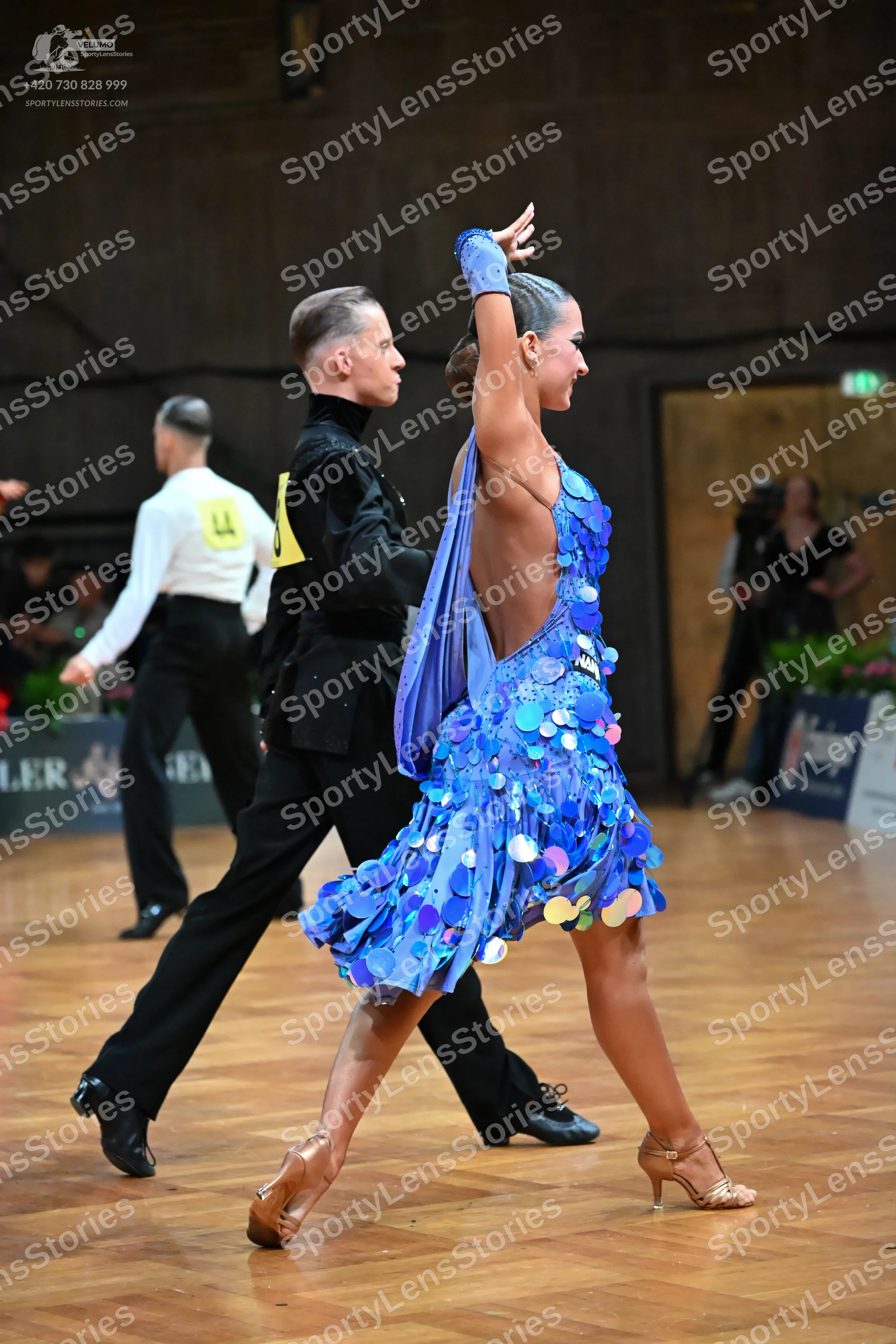 Dancesport competitor: Male dancer: black long-sleeved shirt and black trousers