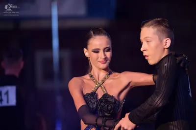 Dancesport competitor #41: Female dancer: black latin dress with 3D floral appliqués, a beaded halter neckl