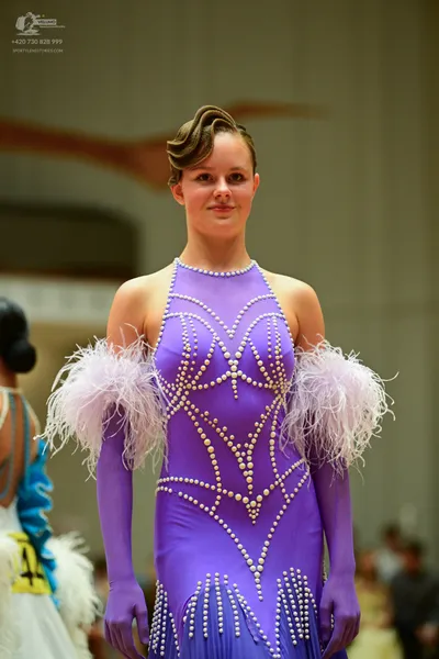 Dancesport competitor: ** Purple, floor-length gown
