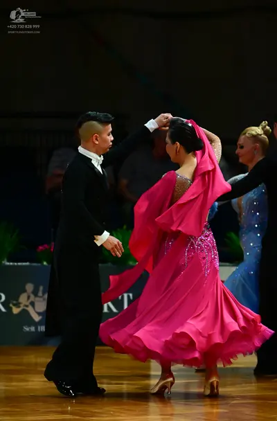 Dancesport competitor: Male dancer: black suit with a white shirt