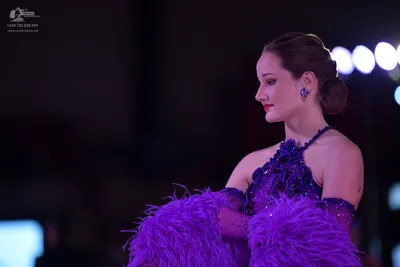 Dancesport competitor: Here’s a breakdown of the dancers’ costumes as seen in the photo, formatted as r