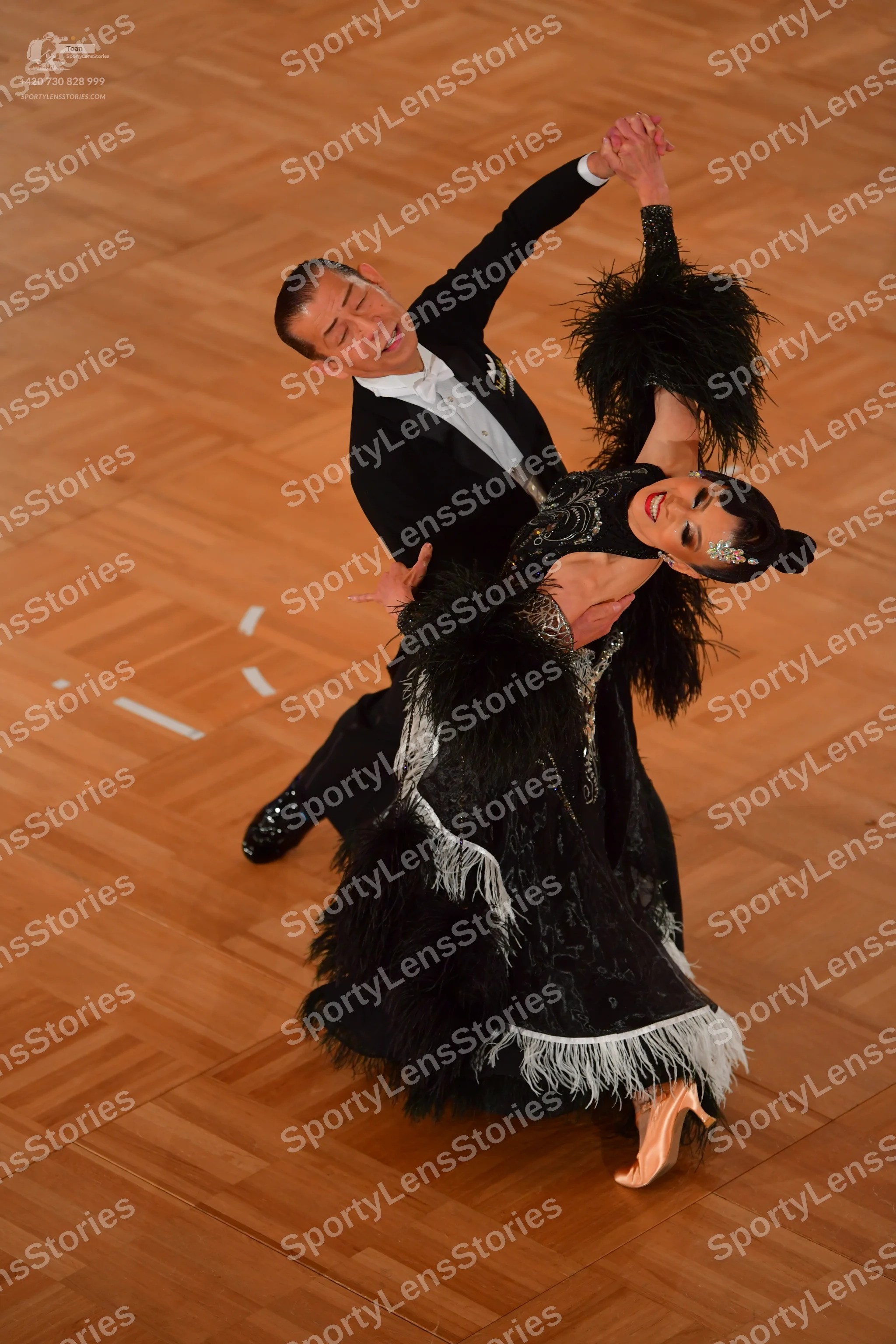 Dancesport competitor: Male dancer: black suit with a white shirt