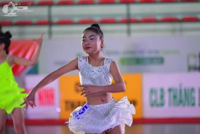 Dancesport competitor: ** Short, sparkling, cropped top and shorts