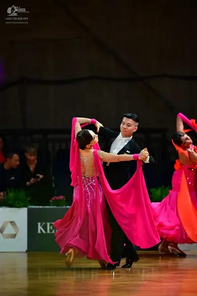 Dancesport competitor: Male dancer: black suit with a white shirt and black bowtie