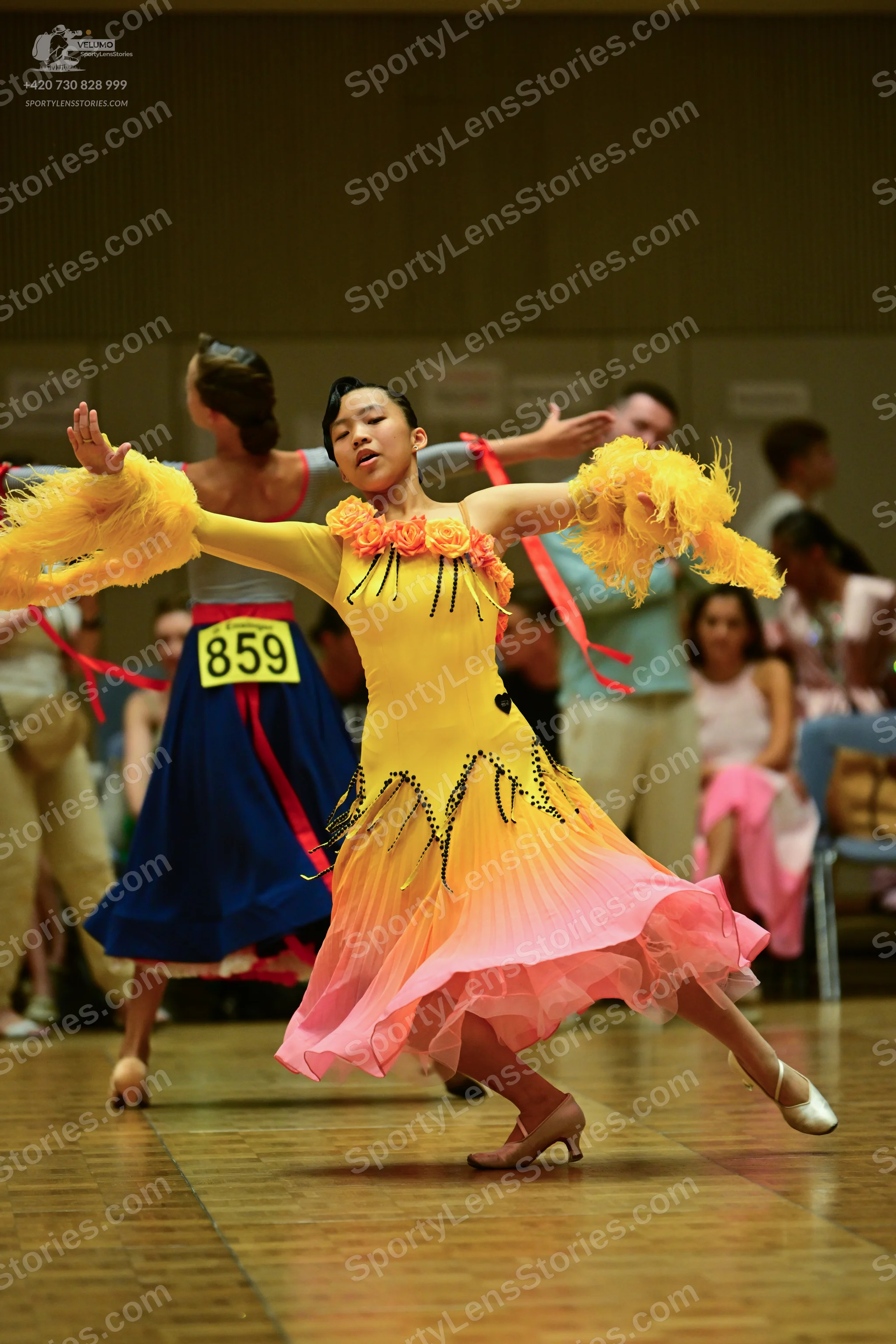 Dancesport competitor #8591: ** Yellow (light peach) fitted bodice with flowing, layered skirt