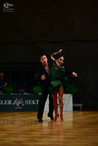 Dancesport competitor: Male dancer: black long-sleeved shirt and black trousers