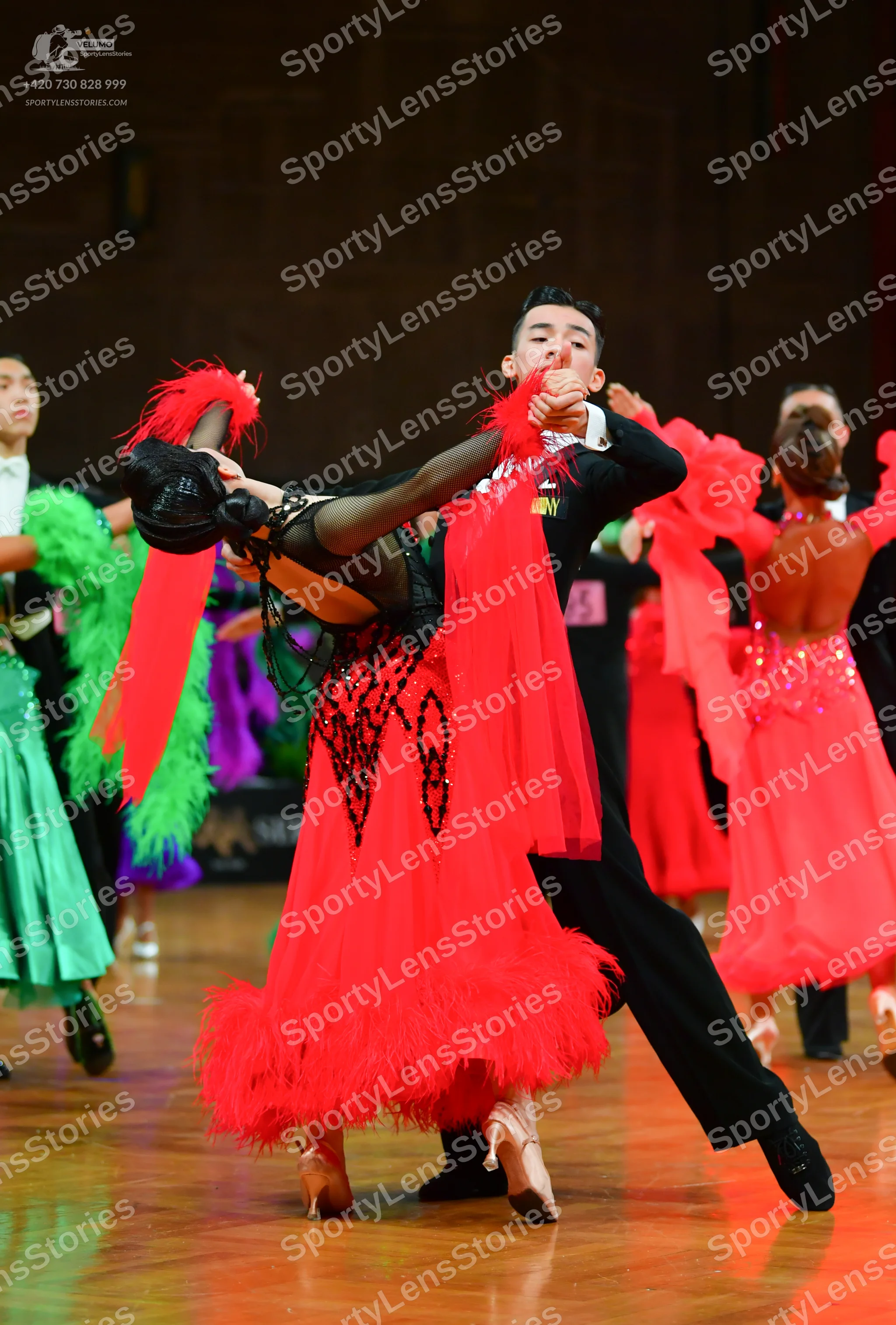 Dancesport competitor: Male dancer: black suit, black trousers, and black shoes