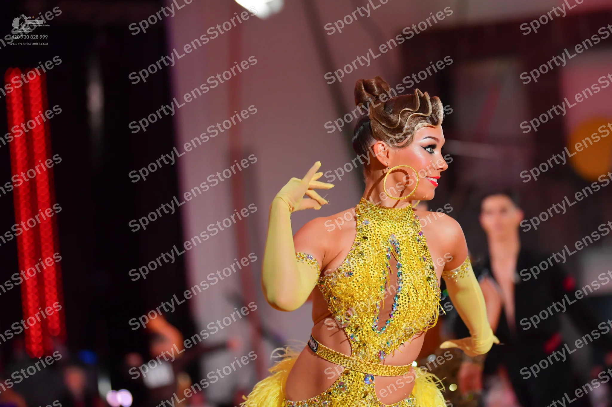 Dancesport competitor: Female dancer: yellow/gold Latin dance dress with heavy sequin/crystal embellish