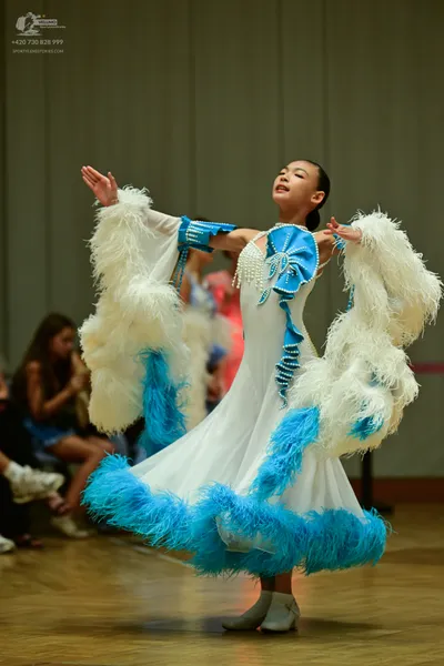 Dancesport competitor: ** White ballgown style dress