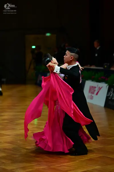 Dancesport competitor: Male dancer: black suit with a white shirt