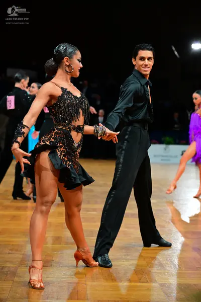 Dancesport competitor: Male dancer: black shirt and black trousers