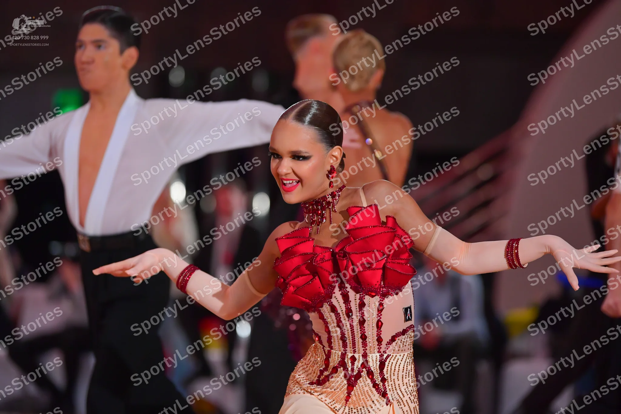 Dancesport competitor: Male dancer: white shirt with a deep V-neck and black trousers