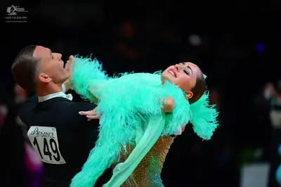 Dancesport competitor #149: Male dancer: black long-sleeved top with a white collar