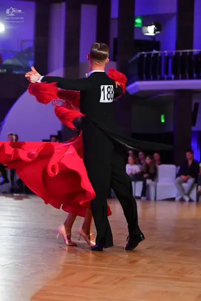 Dancesport competitor #188: Male dancer: black long-sleeved top and trousers