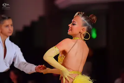Dancesport competitor: Male dancer: white long-sleeved shirt