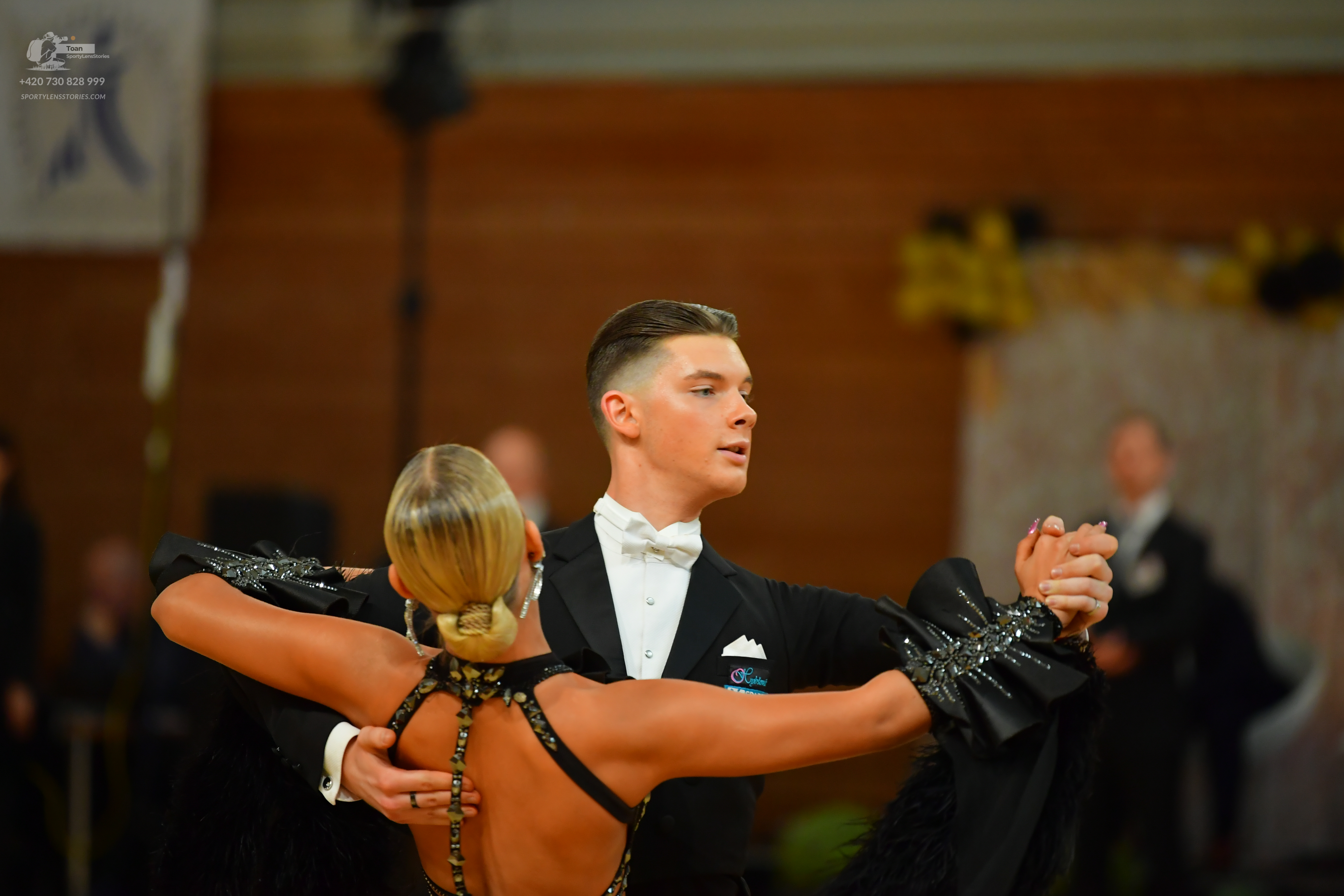 Dancesport competitor: ** Male: Black tail suit with a white dress shirt and a white bow tie