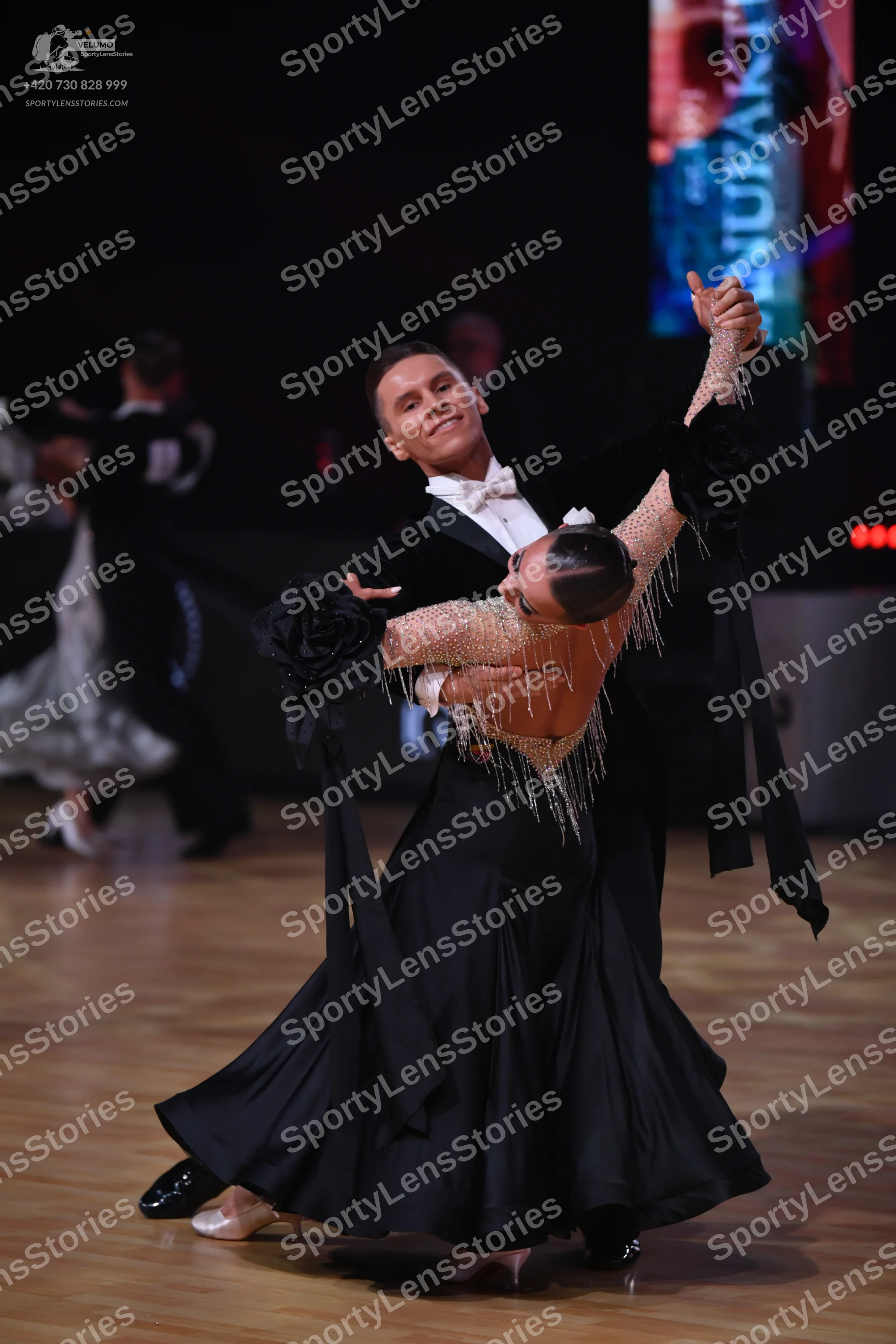 Dancesport competitor: Male dancer: black ballroom tailcoat with a white shirt and white bow tie
