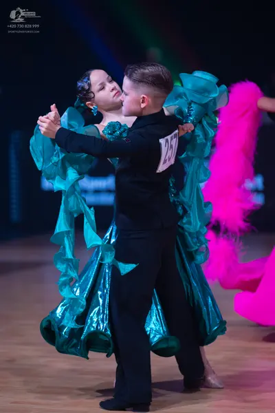 Dancesport competitor: Male dancer: black suit