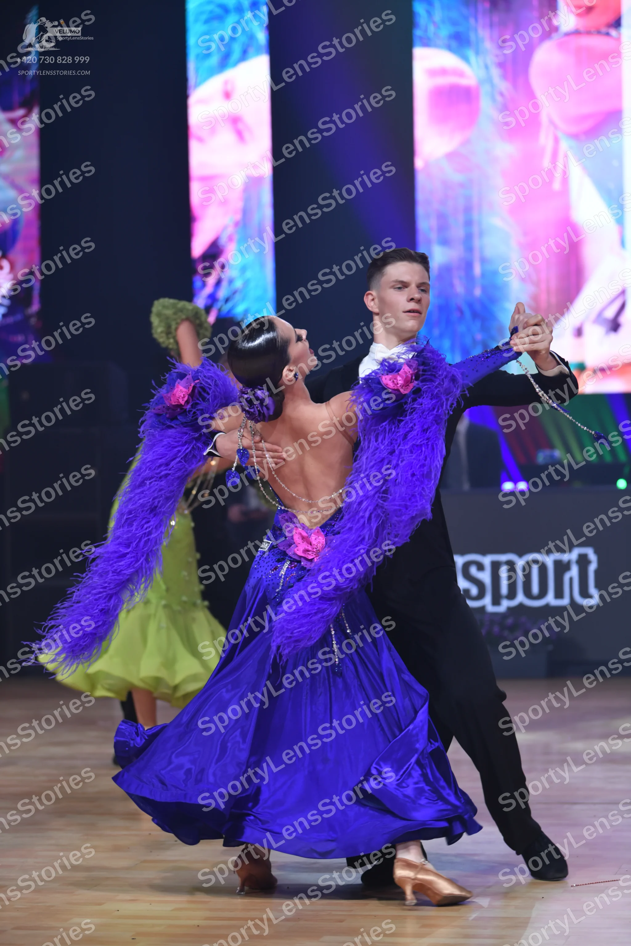Dancesport competitor: Male dancer: black suit with a white shirt and black bow tie