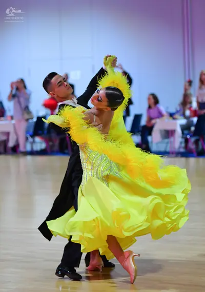 Dancesport competitor: Male dancer: black suit with a white shirt