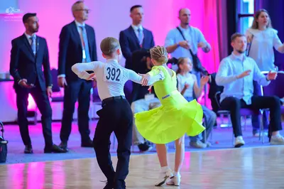 Dancesport competitor #392: Male dancer: white long-sleeved shirt and black trousers