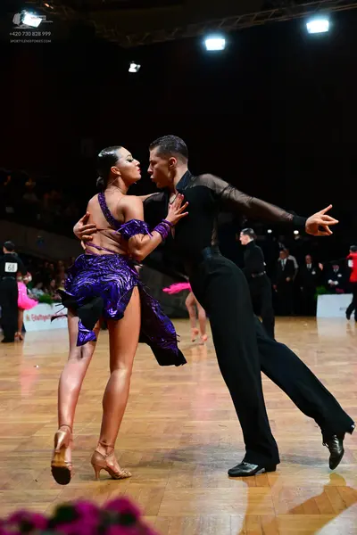 Dancesport competitor #68: Female dancer: purple latin dress with sequin patterns