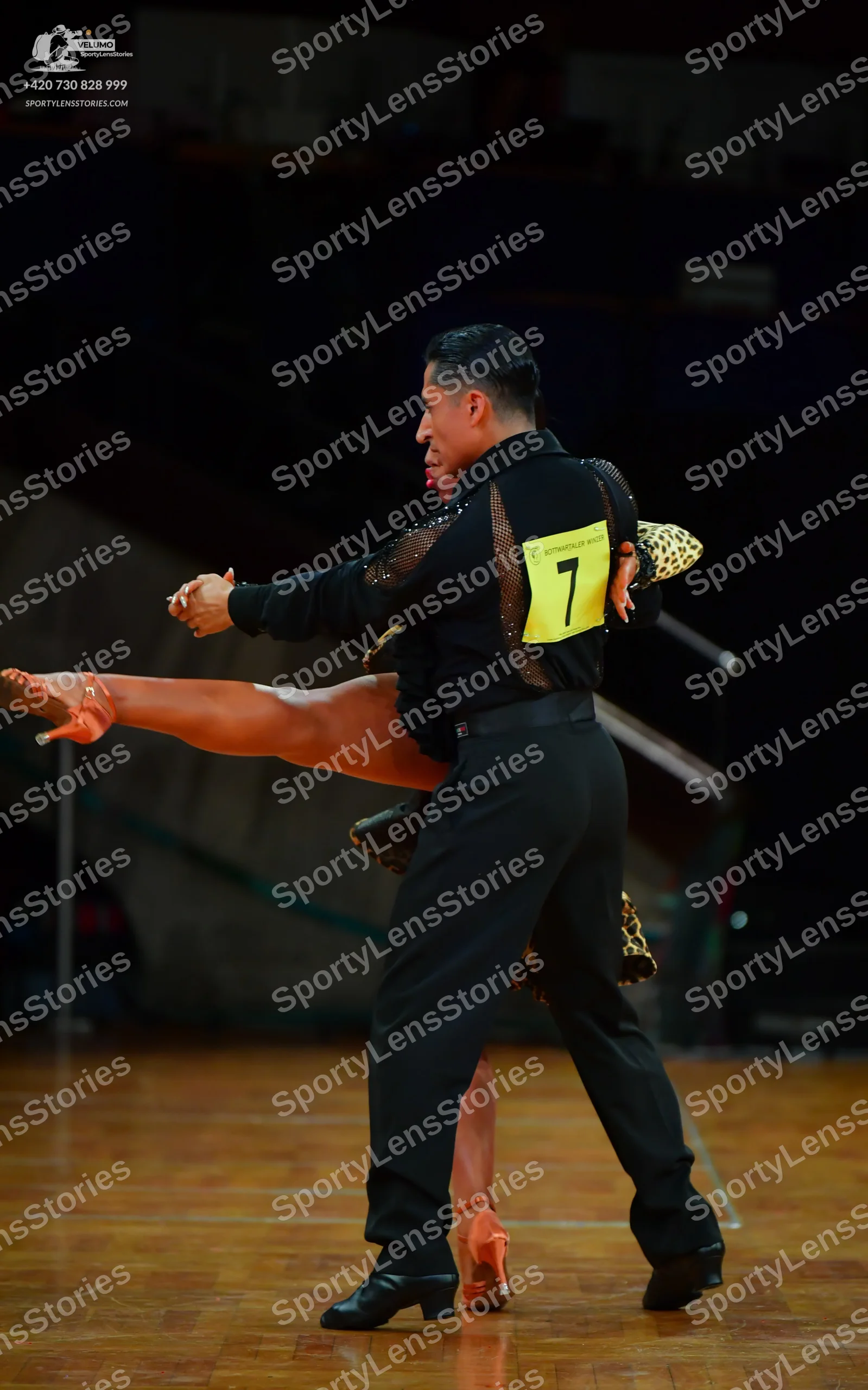 Dancesport competitor: Male dancer: black long-sleeved shirt with black sequin detail on the sleeves an
