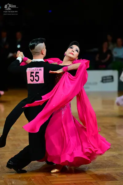 Dancesport competitor #55: Male dancer: black long-sleeved dance top and black trousers