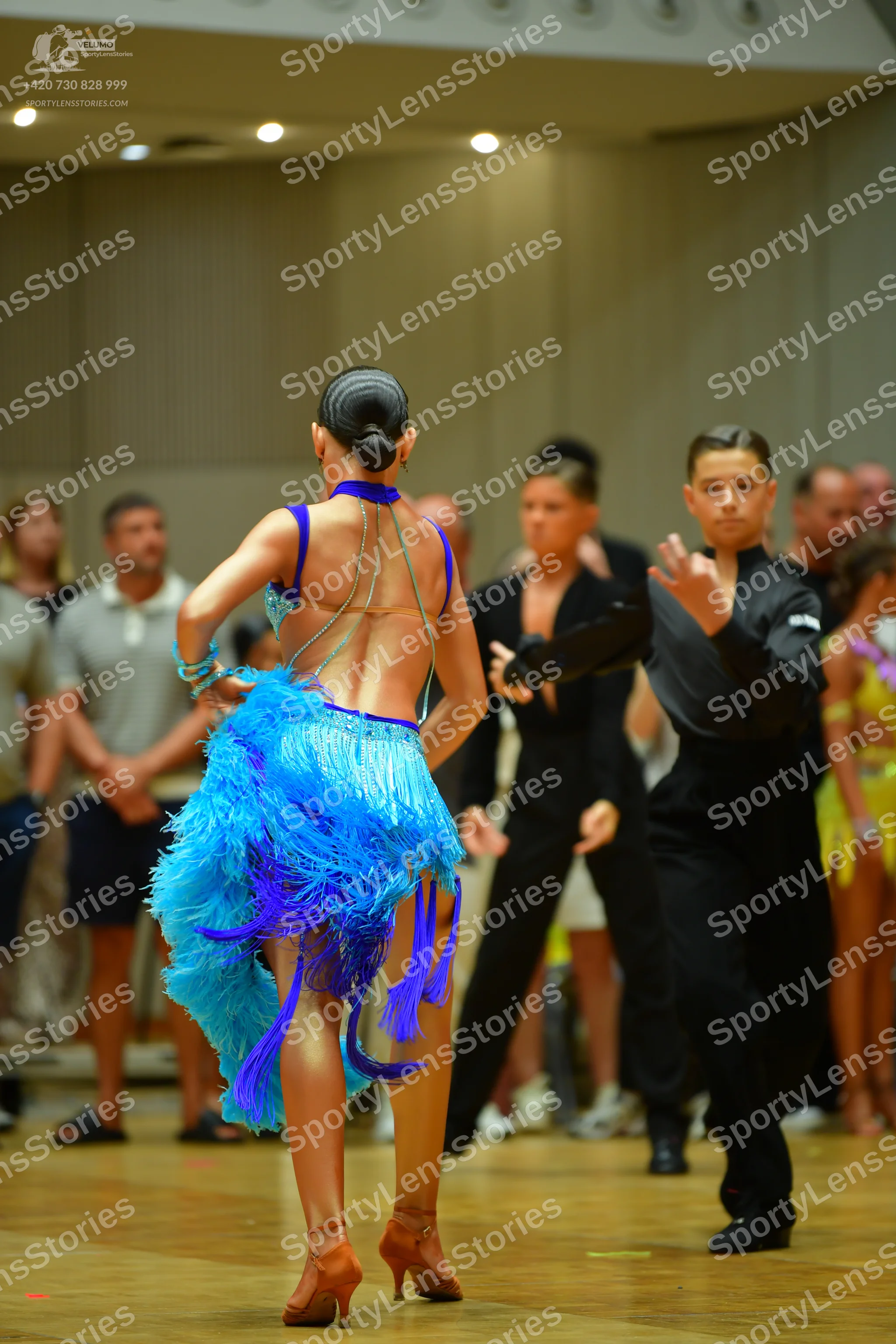 Dancesport competitor: Female dancer: blue and purple latin dance dress with fringe