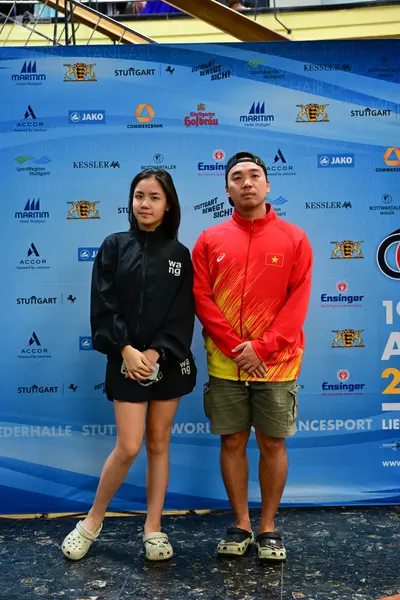 Dancesport competitor: Female dancer: black long-sleeved jacket and black shorts