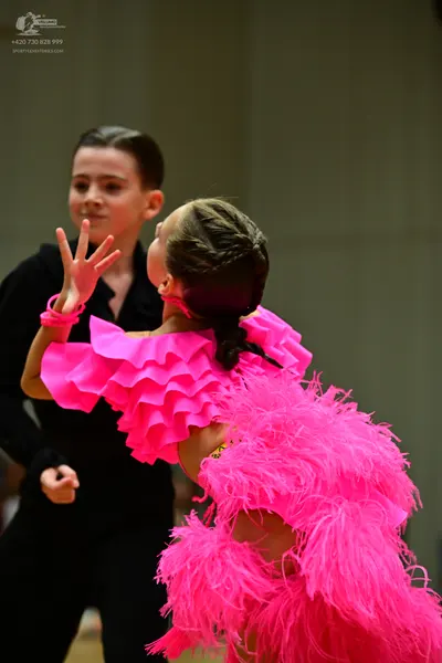 Dancesport competitor: Male dancer: black long-sleeved shirt and black trousers