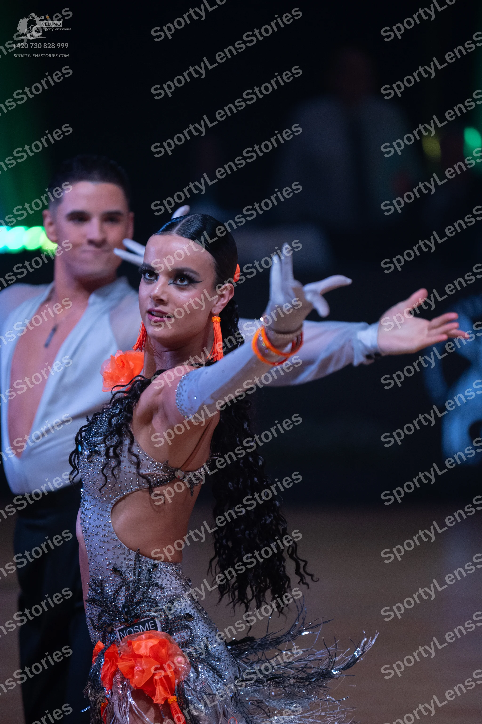 Dancesport competitor: Male dancer: white deep V-neck Latin shirt and black trousers