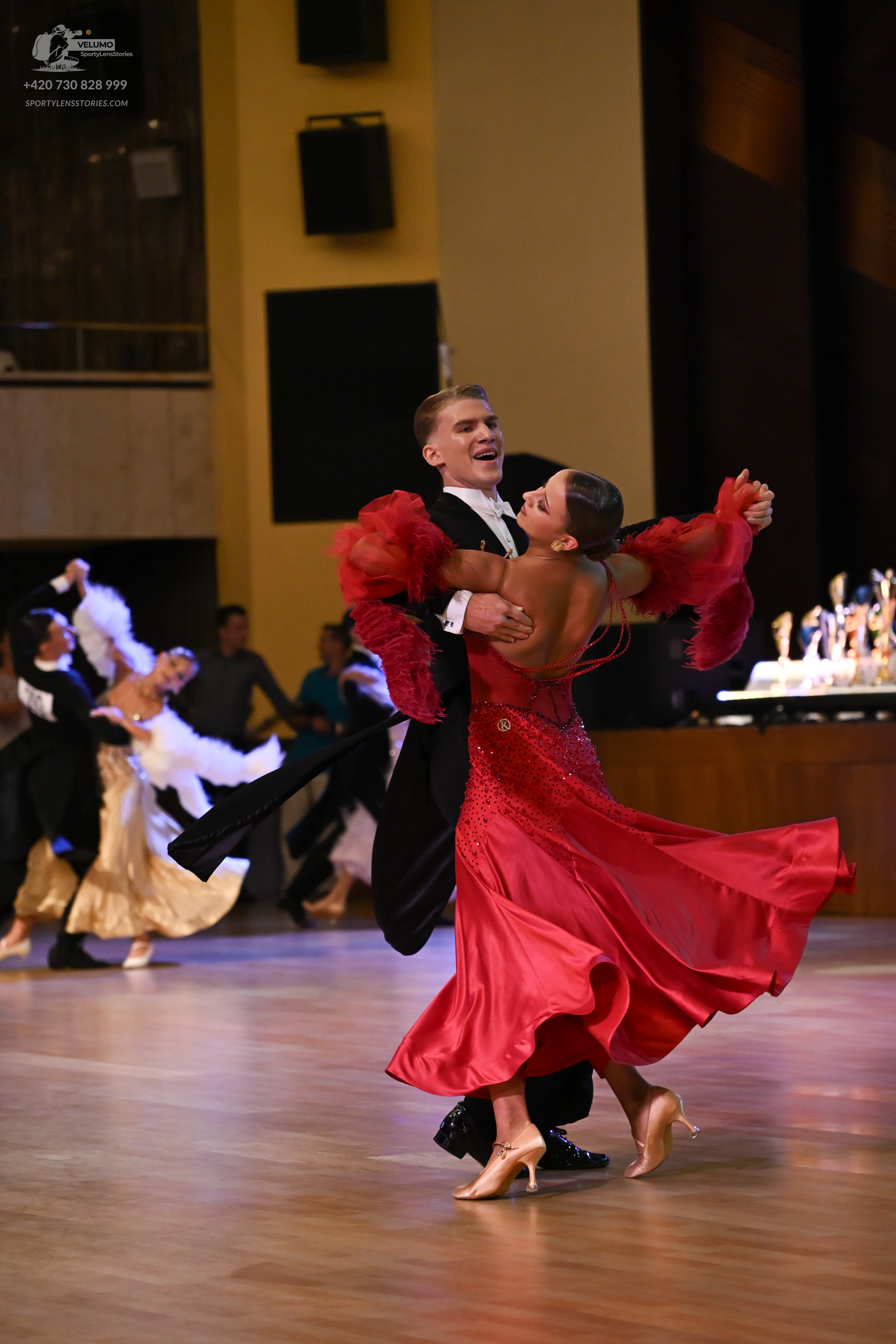 Dancesport competitor: ** Black tail suit
*   **Fabric:** Satin (appears to be a shiny satin)
*   **Sty