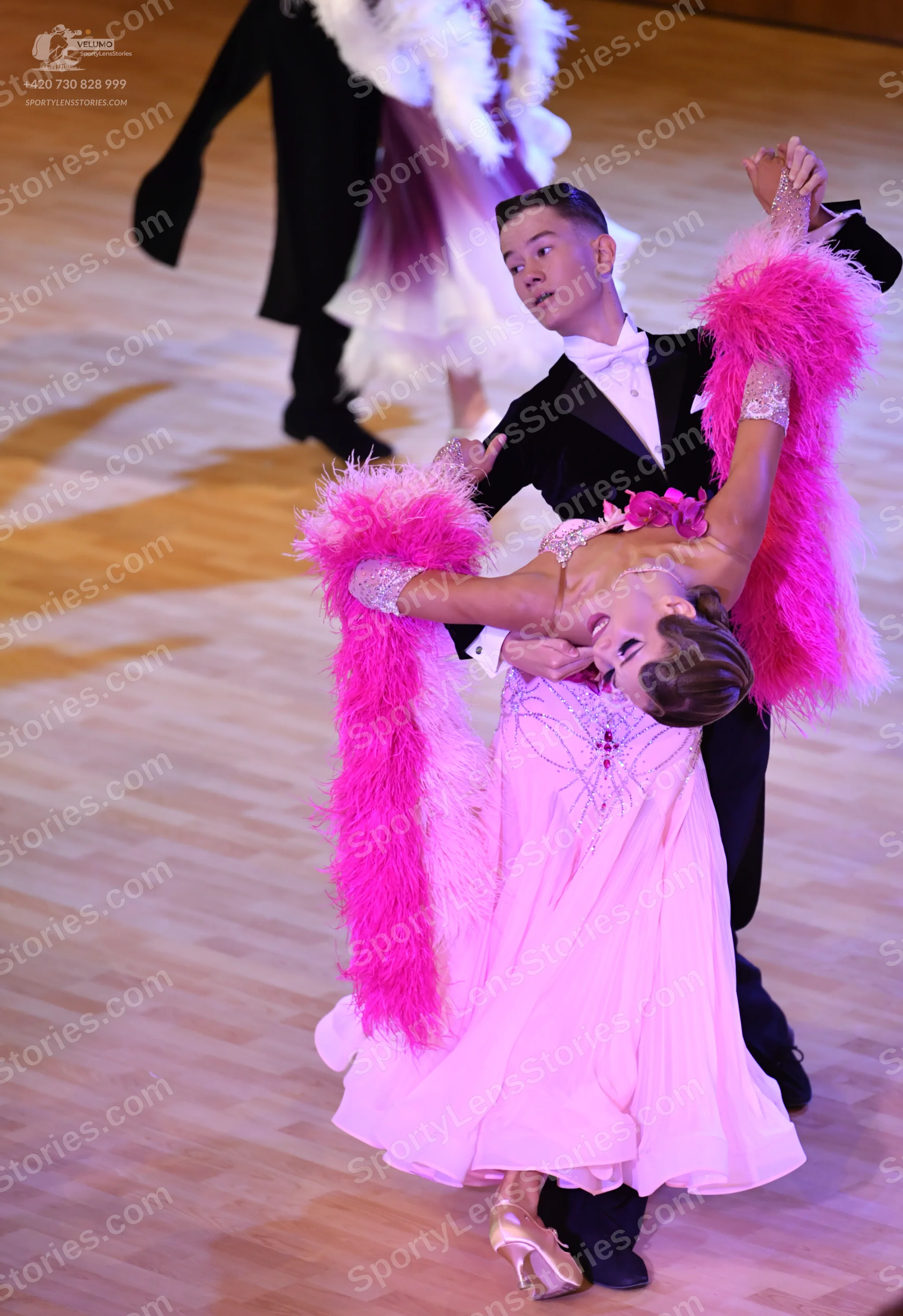 Dancesport competitor: ** Black suit with a satin lapel
*   **Fabric:** Satin
*   **Style:** Suit
*   *