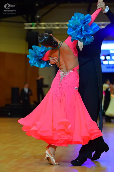 Dancesport competitor: Male dancer: black formal ballroom suit with a white shirt and black trousers