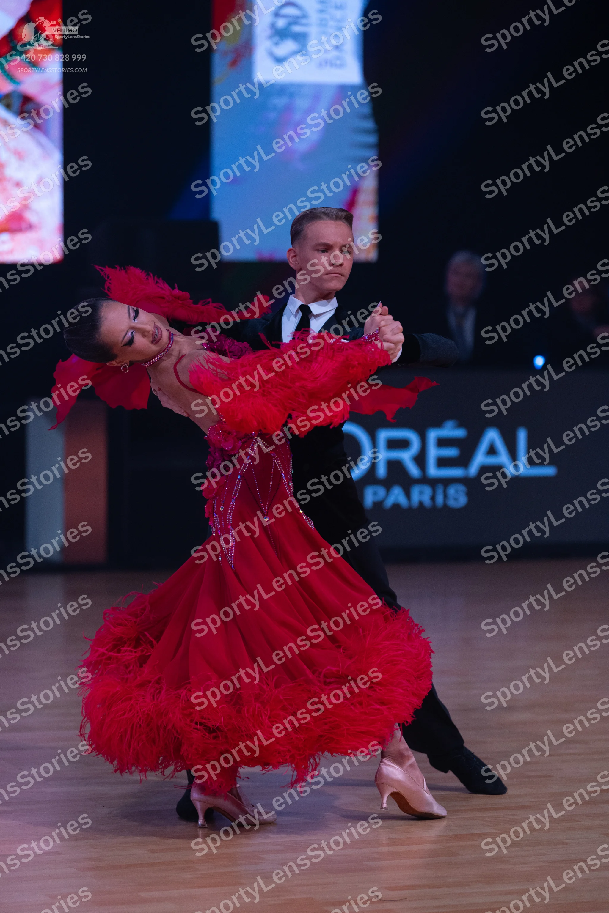 Dancesport competitor: Male dancer: black suit, white shirt, and black necktie