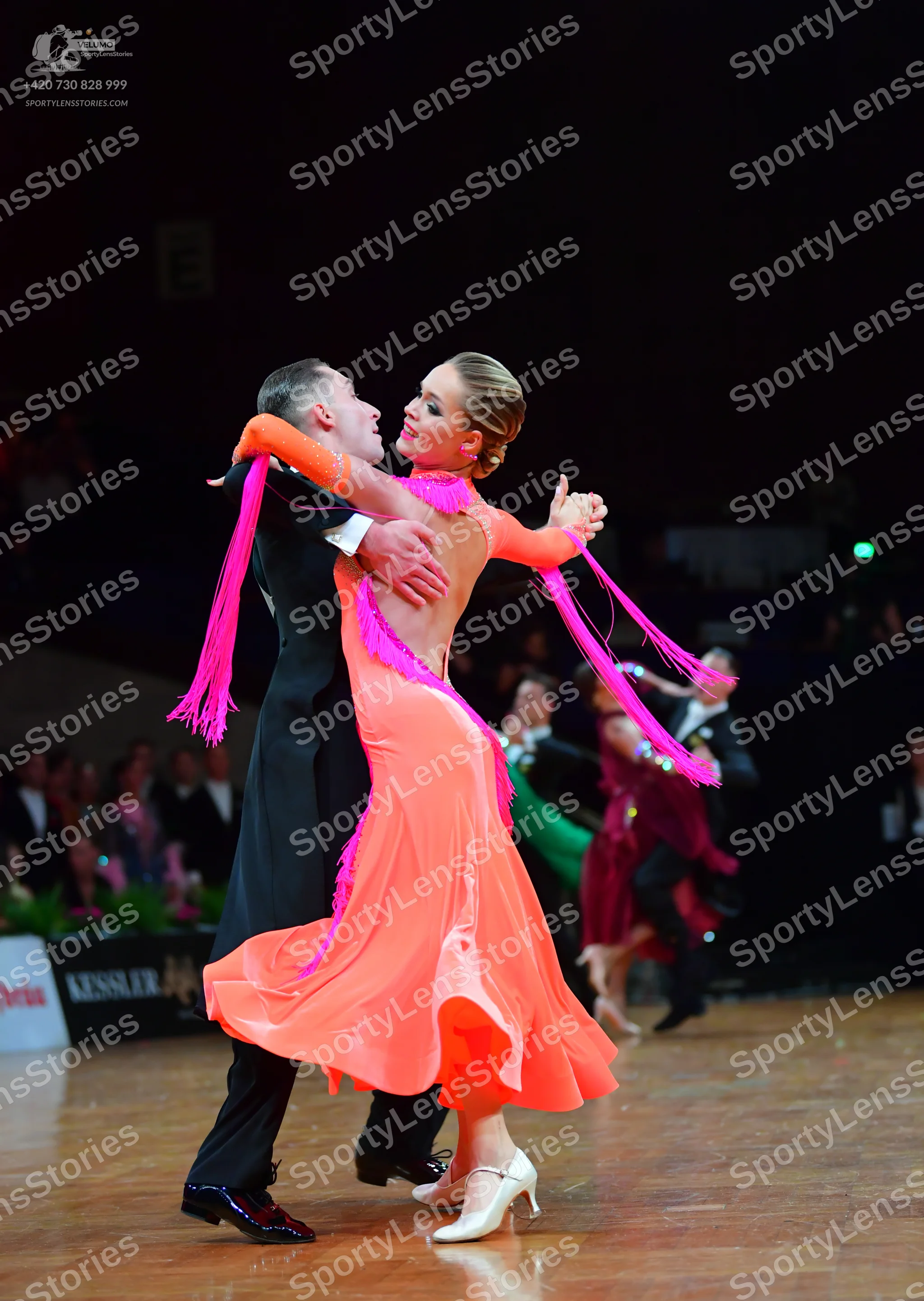 Dancesport competitor: Male dancer: black suit with a white shirt and black dance shoes