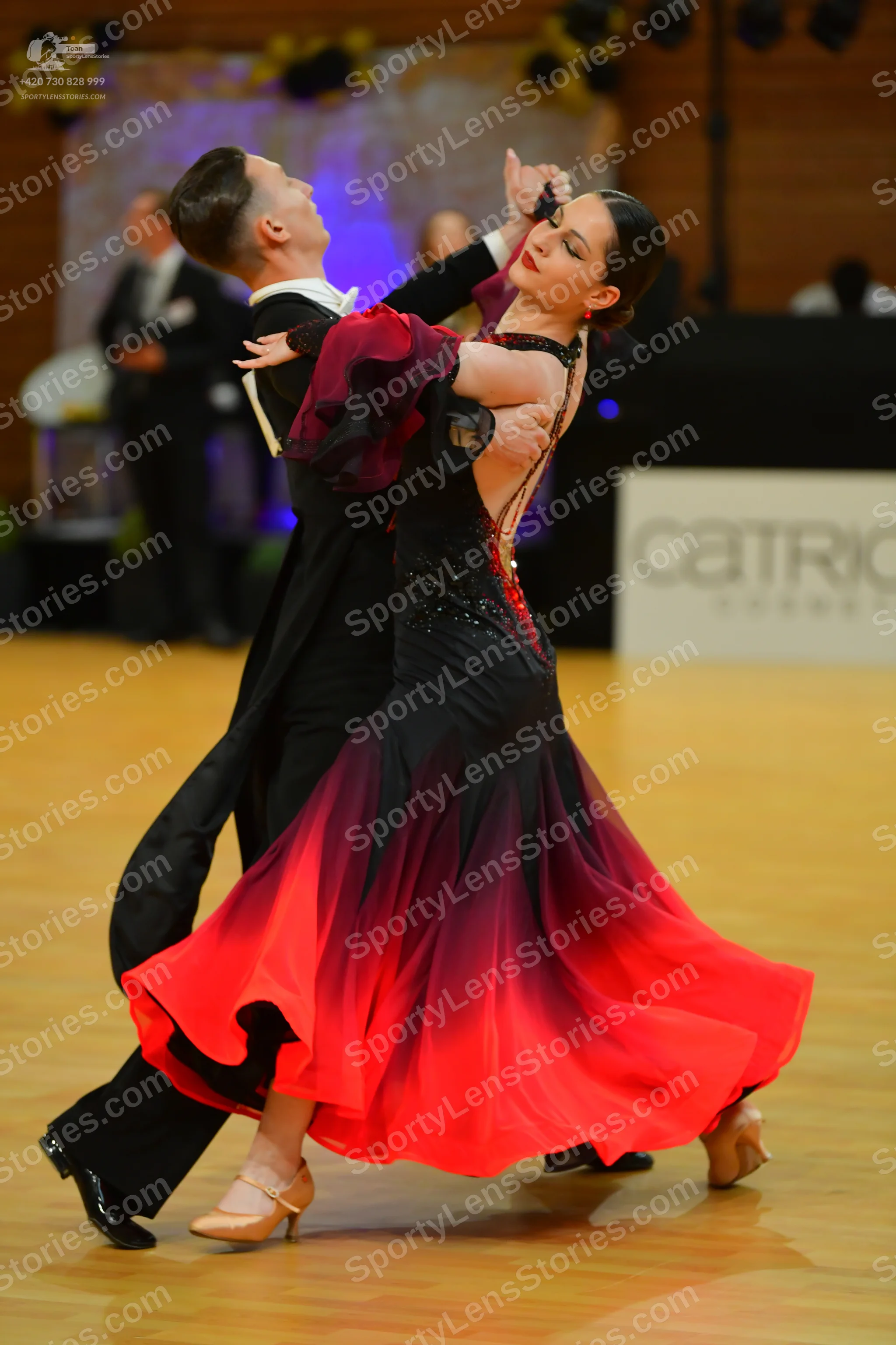 Dancesport competitor: Male dancer: black ballroom suit with a white shirt and black trousers