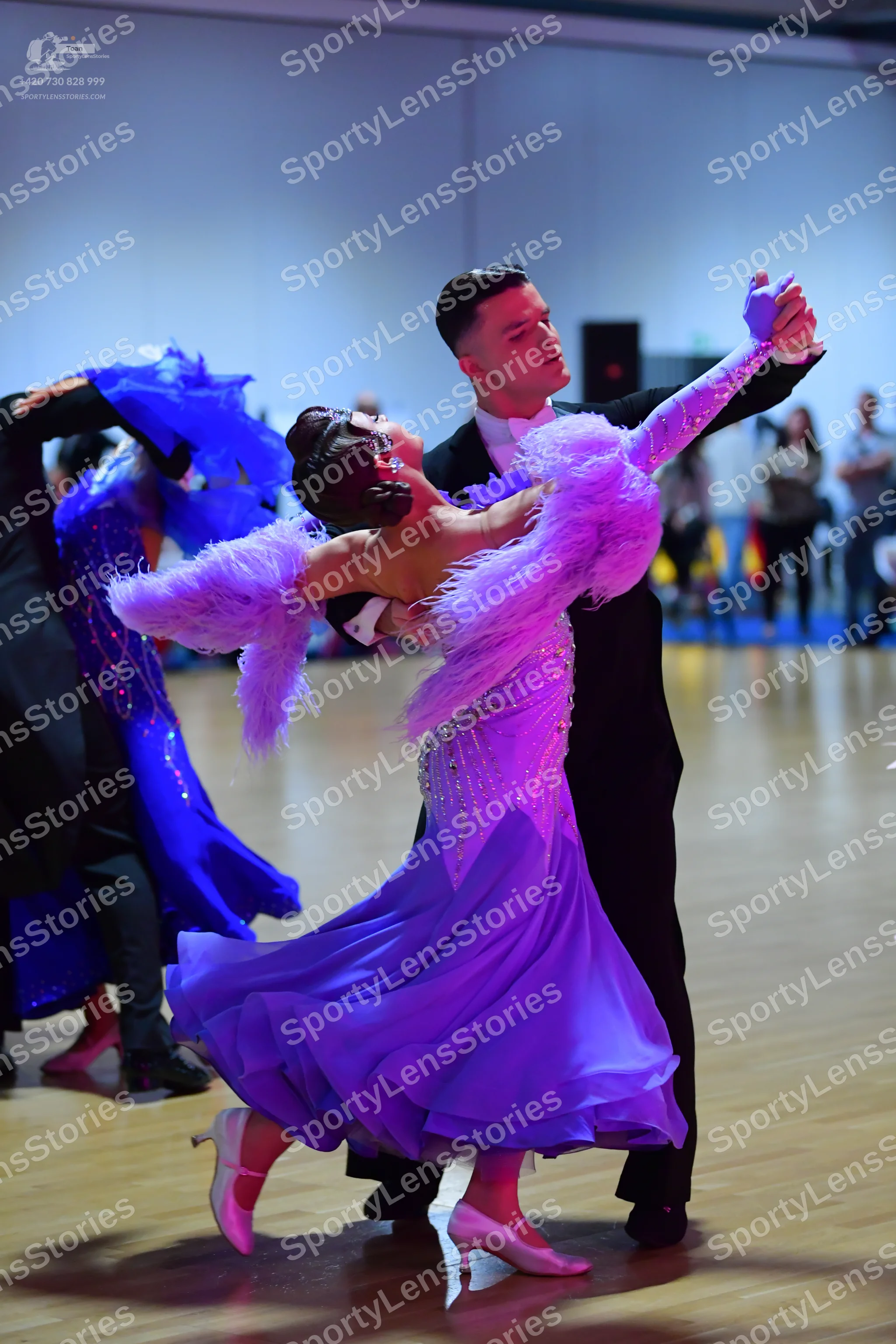 Dancesport competitor: Male dancer: black suit with white shirt and white bow tie