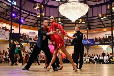 Dancesport competitor #58: Male dancer (foreground): black dance suit